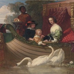 A young family feeding a swan